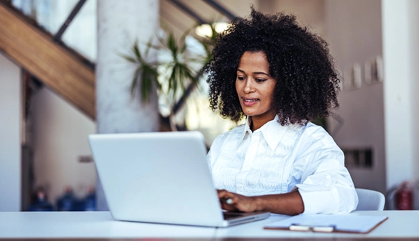 Businesswoman working on a laptop in an office